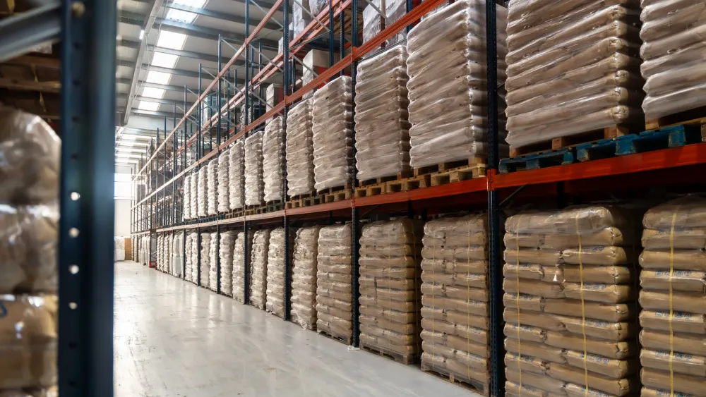 Sacks of certified organic cocoa beans stored separately in a warehouse